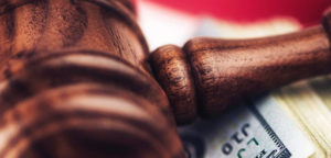 gavel lying on money close up