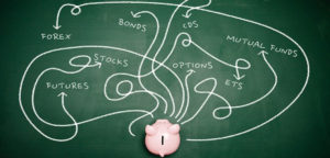 piggybankd with various routs to investing drawn in chalk