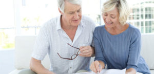 elderly couple reviewing their insurance coverage