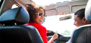 mother driving her son in vehicle