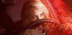 female texting and driving