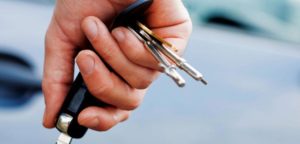man holding car keys in right hand